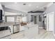 Bright kitchen features granite counters, stainless appliances, a copper sink, and an island at 71 Blaven Dr, Henderson, NV 89002