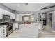 Modern kitchen with stainless steel appliances, an island, white cabinetry, and stylish countertops at 71 Blaven Dr, Henderson, NV 89002