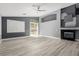 Bright living room featuring a fireplace, stylish flooring, neutral paint, and access to the backyard at 71 Blaven Dr, Henderson, NV 89002
