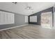 Spacious living room boasting neutral paint, modern flooring, and natural light from windows and sliding glass door at 71 Blaven Dr, Henderson, NV 89002