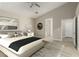 Staged primary bedroom with vaulted ceilings and ensuite bathroom at 71 Blaven Dr, Henderson, NV 89002