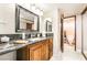 Well-lit bathroom boasting a granite countertop vanity and access to a separate toilet space at 750 S Royal Crest Cir # 317, Las Vegas, NV 89169
