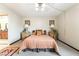 Neutral bedroom with a plush bed, framed art and matching bedside tables creating a warm, inviting space at 750 S Royal Crest Cir # 317, Las Vegas, NV 89169