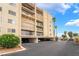 Exterior view of condo building showing multiple balconies and levels and underground parking at 750 S Royal Crest Cir # 317, Las Vegas, NV 89169