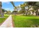 Great walking path on the green grounds around the condos on a beautiful sunny day with blue skies at 750 S Royal Crest Cir # 317, Las Vegas, NV 89169