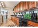 Charming kitchen offering wood cabinets, granite countertops and stainless steel appliances, creating a functional cooking space at 750 S Royal Crest Cir # 317, Las Vegas, NV 89169