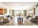Bright living room with tile floors, balcony access, and six chairs at 750 S Royal Crest Cir # 317, Las Vegas, NV 89169