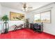 Home office with a ceiling fan, large window and red carpet at 750 S Royal Crest Cir # 317, Las Vegas, NV 89169