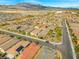 The aerial view showcases the property's roof and the surrounding well-planned neighborhood with green spaces at 8668 Marcana St, Las Vegas, NV 89166