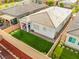 Aerial view of the property with a well-kept backyard, covered patio, and privacy fence at 8668 Marcana St, Las Vegas, NV 89166