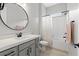 Bathroom featuring a modern vanity with sleek black hardware, toilet and bath/shower combo at 8668 Marcana St, Las Vegas, NV 89166
