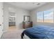 Bedroom view showcasing a window, dresser, and ensuite bathroom for added privacy at 8668 Marcana St, Las Vegas, NV 89166