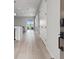 The bright foyer features hardwood floors and offers a glimpse into the open-concept living space at 8668 Marcana St, Las Vegas, NV 89166