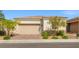 Charming single-story home featuring a two-car garage and desert landscaping for low maintenance appeal at 8668 Marcana St, Las Vegas, NV 89166