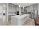 The kitchen boasts a large center island, stainless steel appliances, and ample counter space at 8668 Marcana St, Las Vegas, NV 89166