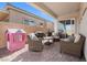 Inviting covered patio with comfortable seating, perfect for outdoor relaxation and entertaining at 8668 Marcana St, Las Vegas, NV 89166