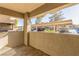 A balcony offers a view of covered parking and neighboring buildings, with a concrete barrier at 9000 Las Vegas Blvd # 1016, Las Vegas, NV 89123