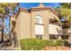 Exterior view of a residential building with a two-story facade, staircase, and desert landscaping at 9000 Las Vegas Blvd # 1016, Las Vegas, NV 89123