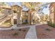 A two-story apartment building features private entrances, desert landscaping, and walkways at 9000 Las Vegas Blvd # 1016, Las Vegas, NV 89123