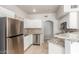 Open kitchen with stainless appliances, stone countertops and backsplash, and a breakfast bar at 9000 Las Vegas Blvd # 1016, Las Vegas, NV 89123
