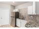 Kitchen featuring stainless steel appliances, granite countertops, and white cabinets at 9000 Las Vegas Blvd # 1016, Las Vegas, NV 89123