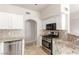 Kitchen featuring stainless steel appliances, granite countertops, tile backsplash, and white cabinets at 9000 Las Vegas Blvd # 1016, Las Vegas, NV 89123