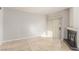 Bright and airy living room with fireplace, tile floor, and sliding glass door at 9000 Las Vegas Blvd # 1016, Las Vegas, NV 89123