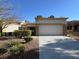 Single-story home featuring a desert landscape, stucco exterior, and a wide garage at 9369 Villa Ridge Dr, Las Vegas, NV 89134