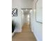 Bright hallway with light wood floors and white walls leads to other rooms at 9369 Villa Ridge Dr, Las Vegas, NV 89134