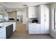 Clean, modern kitchen with an open concept, quartz countertops, and neutral tones throughout at 9369 Villa Ridge Dr, Las Vegas, NV 89134