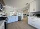 Bright kitchen featuring white cabinets, stainless steel appliances, and an open design at 9369 Villa Ridge Dr, Las Vegas, NV 89134