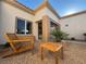 Relaxing patio area with modern outdoor seating and a minimalist landscape design at 9369 Villa Ridge Dr, Las Vegas, NV 89134