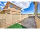 The cozy backyard featuring a small patio, artificial grass area, and rock landscaping at 978 Valetta Flat Ave, Las Vegas, NV 89183