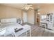 Bedroom with neutral walls, plank flooring, ceiling fan, and natural light at 978 Valetta Flat Ave, Las Vegas, NV 89183
