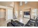 Bright living room with high ceilings, modern furniture and tile floors at 978 Valetta Flat Ave, Las Vegas, NV 89183
