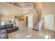 Open concept living area with a staircase and a view of the kitchen and dining area at 978 Valetta Flat Ave, Las Vegas, NV 89183