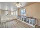 Upstairs loft featuring plank flooring, a ceiling fan, and built-in dog crates at 978 Valetta Flat Ave, Las Vegas, NV 89183