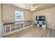 Upstairs loft featuring plank flooring, a ceiling fan, and built-in dog crates at 978 Valetta Flat Ave, Las Vegas, NV 89183