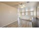 Upstairs loft featuring plank flooring, a ceiling fan, and neutral paint at 978 Valetta Flat Ave, Las Vegas, NV 89183