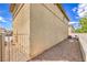Side yard with rock landscaping and a view of the home's exterior at 978 Valetta Flat Ave, Las Vegas, NV 89183