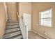 Staircase with painted wood steps and white railing at 978 Valetta Flat Ave, Las Vegas, NV 89183