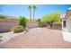 Spacious backyard with low-maintenance desert landscaping and a secure brick wall at 10321 Marymont Pl, Las Vegas, NV 89134