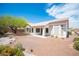 Spacious backyard with desert landscaping and a covered patio, great for outdoor entertaining at 10321 Marymont Pl, Las Vegas, NV 89134