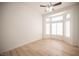 Bedroom featuring light-colored floors, base molding, and a large window for natural light at 10321 Marymont Pl, Las Vegas, NV 89134
