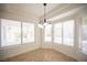 An eat-in kitchen dining nook features a chandelier and bright natural light at 10321 Marymont Pl, Las Vegas, NV 89134