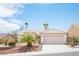 Charming single-story home featuring a well-maintained yard with desert landscaping and a two-car garage at 10321 Marymont Pl, Las Vegas, NV 89134