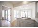 Bright kitchen features recessed lighting, a breakfast bar, tile floors, and stainless steel sink at 10321 Marymont Pl, Las Vegas, NV 89134