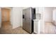 Bright kitchen with stainless steel refrigerator and white cabinetry at 10321 Marymont Pl, Las Vegas, NV 89134