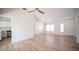 Bright living room with wood floors and entry to the kitchen at 10321 Marymont Pl, Las Vegas, NV 89134