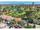 Nevada townhomes with a view of blue lakes and lush green golf course from above on a sunny day at 1034 Tam O Shanter, Las Vegas, NV 89109